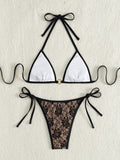 Black lace halter top with floral pattern and nude bikini